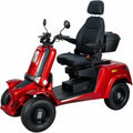 A red and black four-wheeled electric mobility scooter with a high-back seat, black storage trunk, and large black tires, shown on a plain white background.