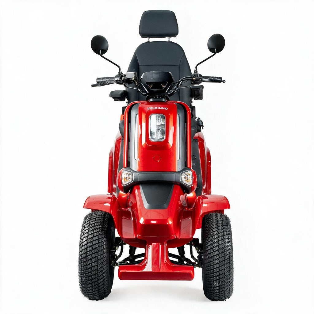 A red and black four-wheel electric lawn mower with a headlight, mirrors, and a backrest seat, shown from a front-facing perspective on a white background.