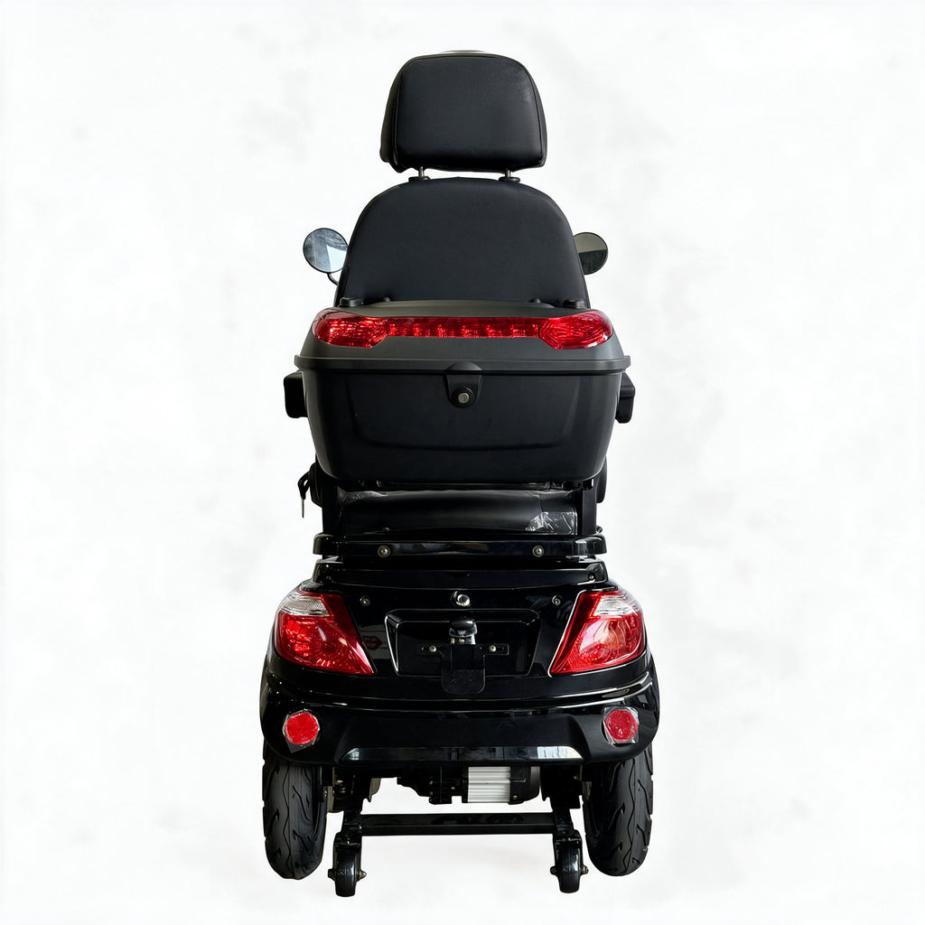 Rear view of a black electric wheelchair scooter with a large storage box, backrest, and red taillights on a white background.