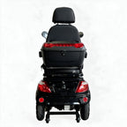 Rear view of a black electric wheelchair scooter with a large storage box, backrest, and red taillights on a white background.