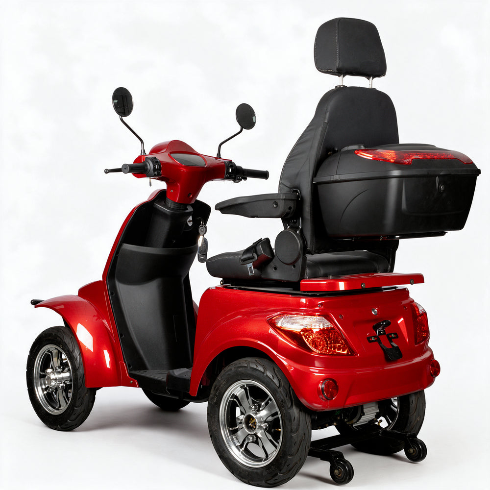 A red and black four-wheel electric mobility scooter with a spacious backrest seat, a large rear storage box, and chrome wheels, shown on a light gray background.